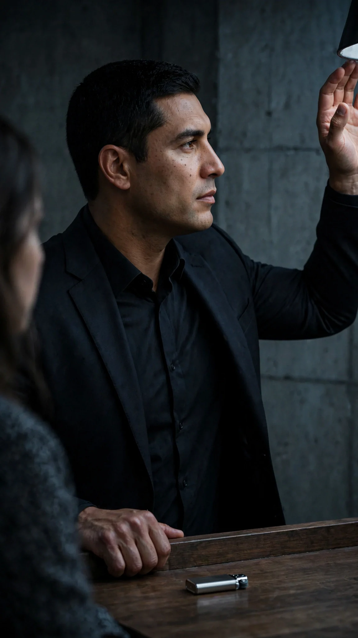 Aurelio turns away toward the lamp, hand still gripping the desk edge, dismissing her.