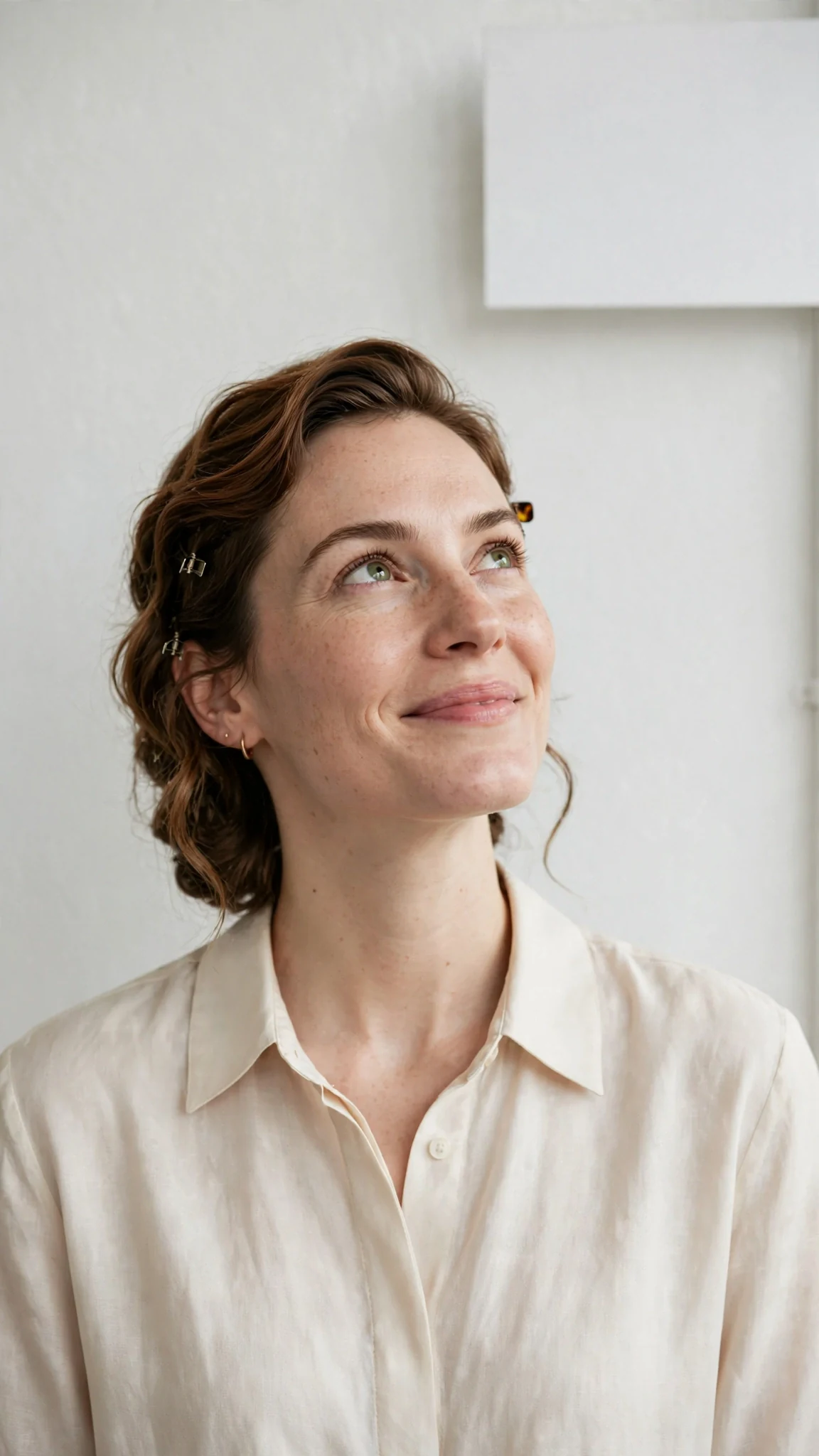 Calla stands in her bright studio and looks up at the sign with her own name on it, smiling a little.