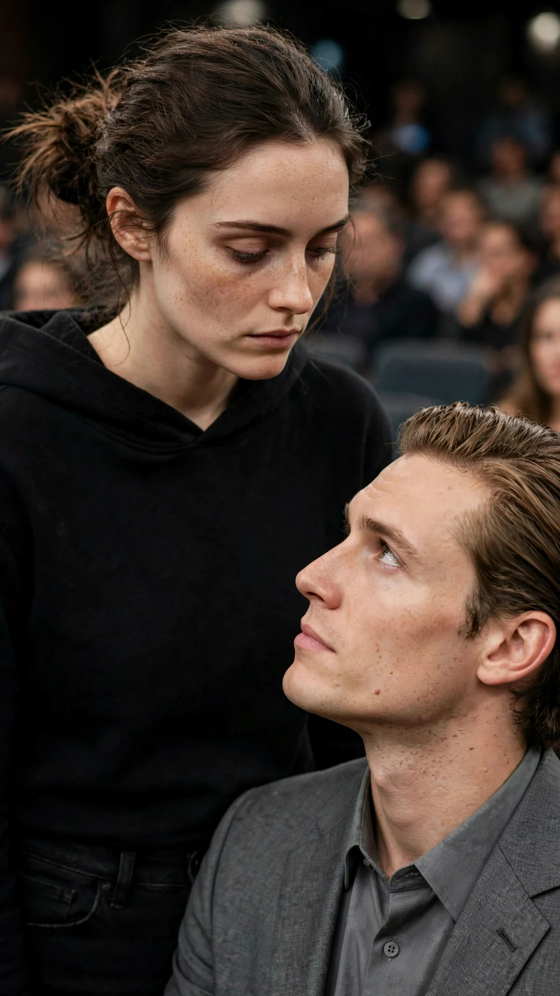 Daphne and Julian stare at each other, her eyes flat.