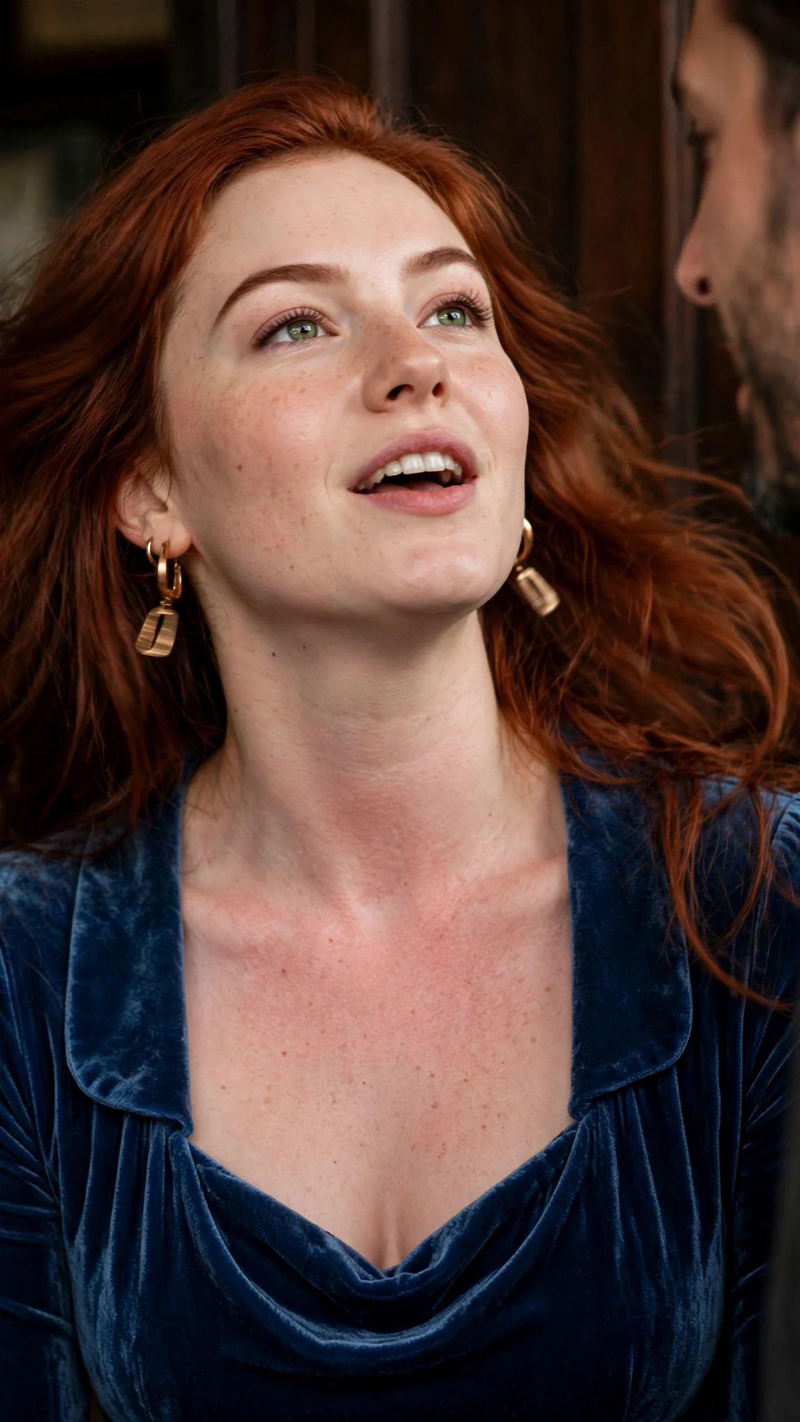 A flushed woman's chin lifts as she speaks, eyes closed.